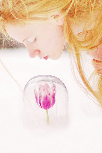 girl smelling flower